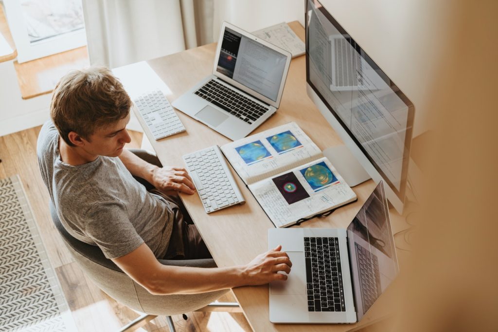 Man using 3 computers BPO