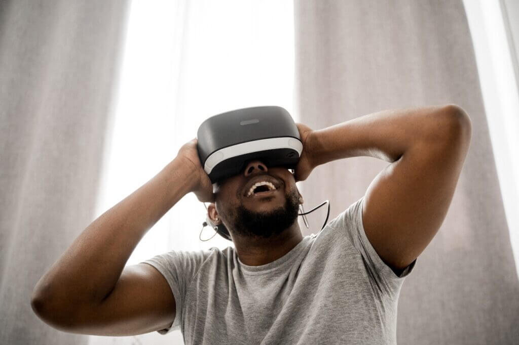 Man with a VR headset on, smiling