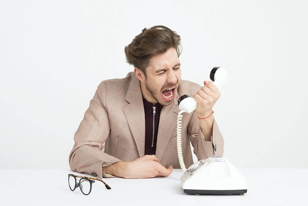 A man yelling over the phone