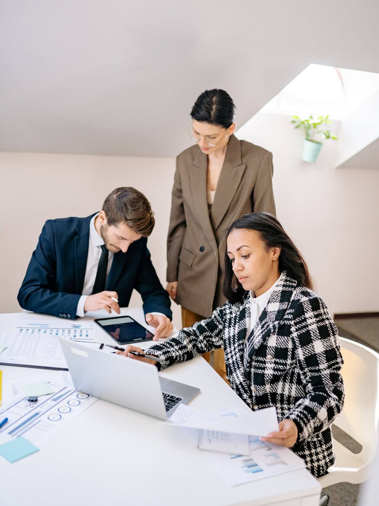 Managers discussing numbers in an office