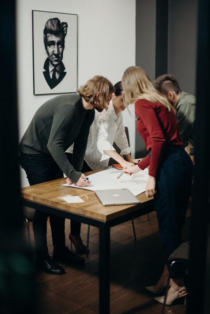 Employees discussing a project at an office meeting.