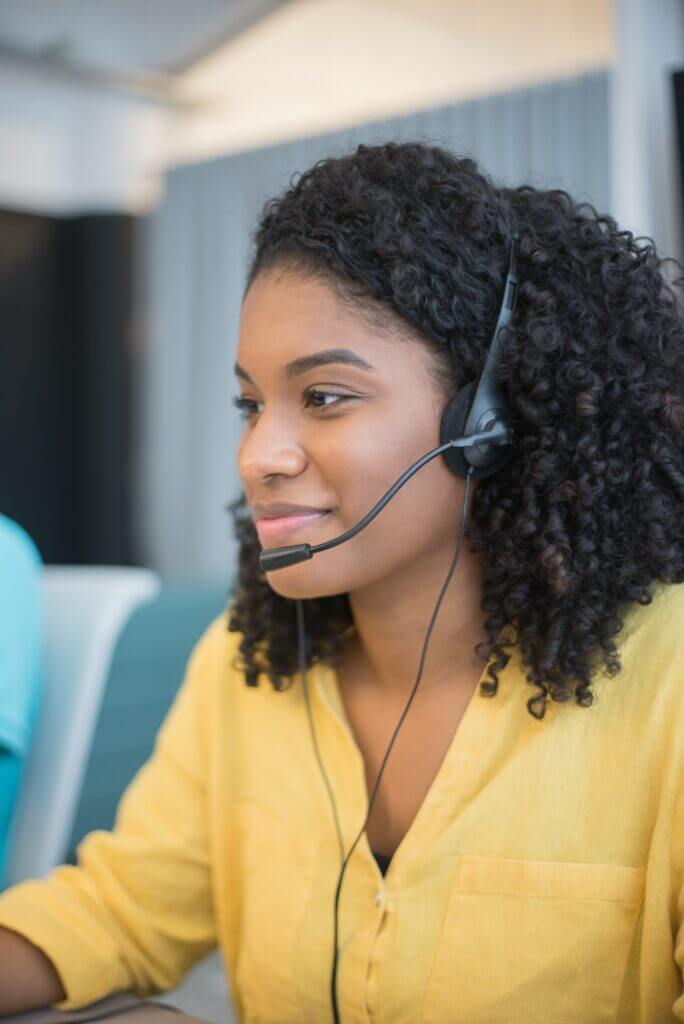 Professional in headset ready to assist with customer inquiries.