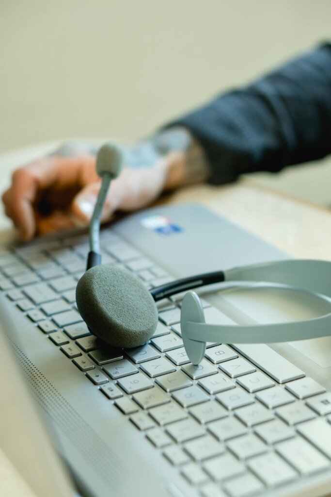 A close-up of a headset on a keyboard.